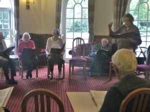 group of people singing. Photo by HelpStation